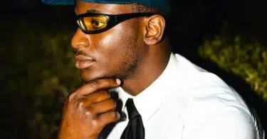 Man in White Dress Shirt and Blue and White Fitted Cap