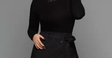 woman wearing black turtleneck long-sleeved dress