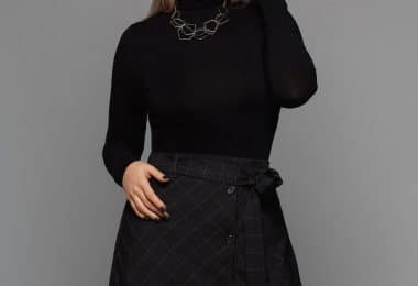 woman wearing black turtleneck long-sleeved dress